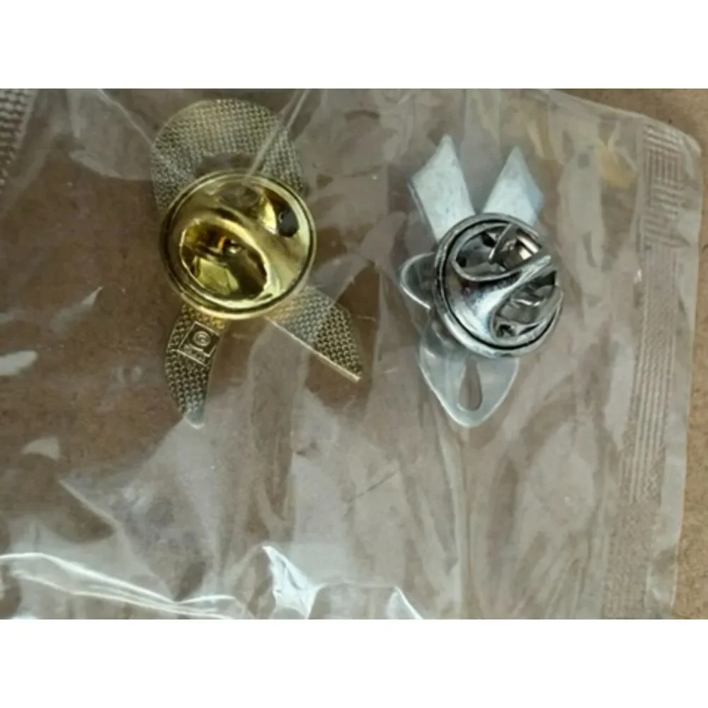 Pink Ribbon label pins one with FORD in center
